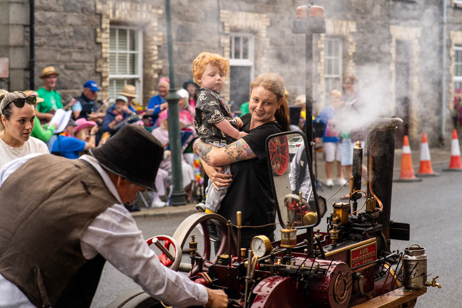 Parent and child looking at a working steam machine during Heritage Week in Greenore 2026