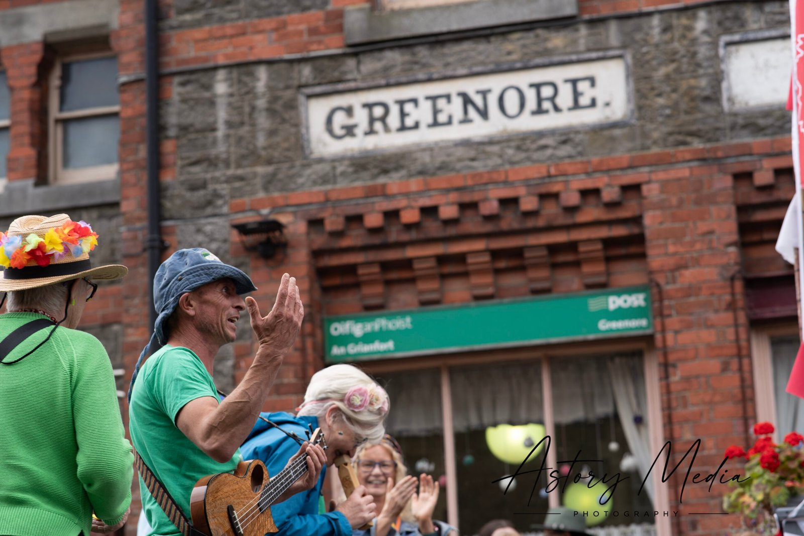 Members of Dundalk Ukulele Strummers beside the Greenore sign during Heritage Week 2026