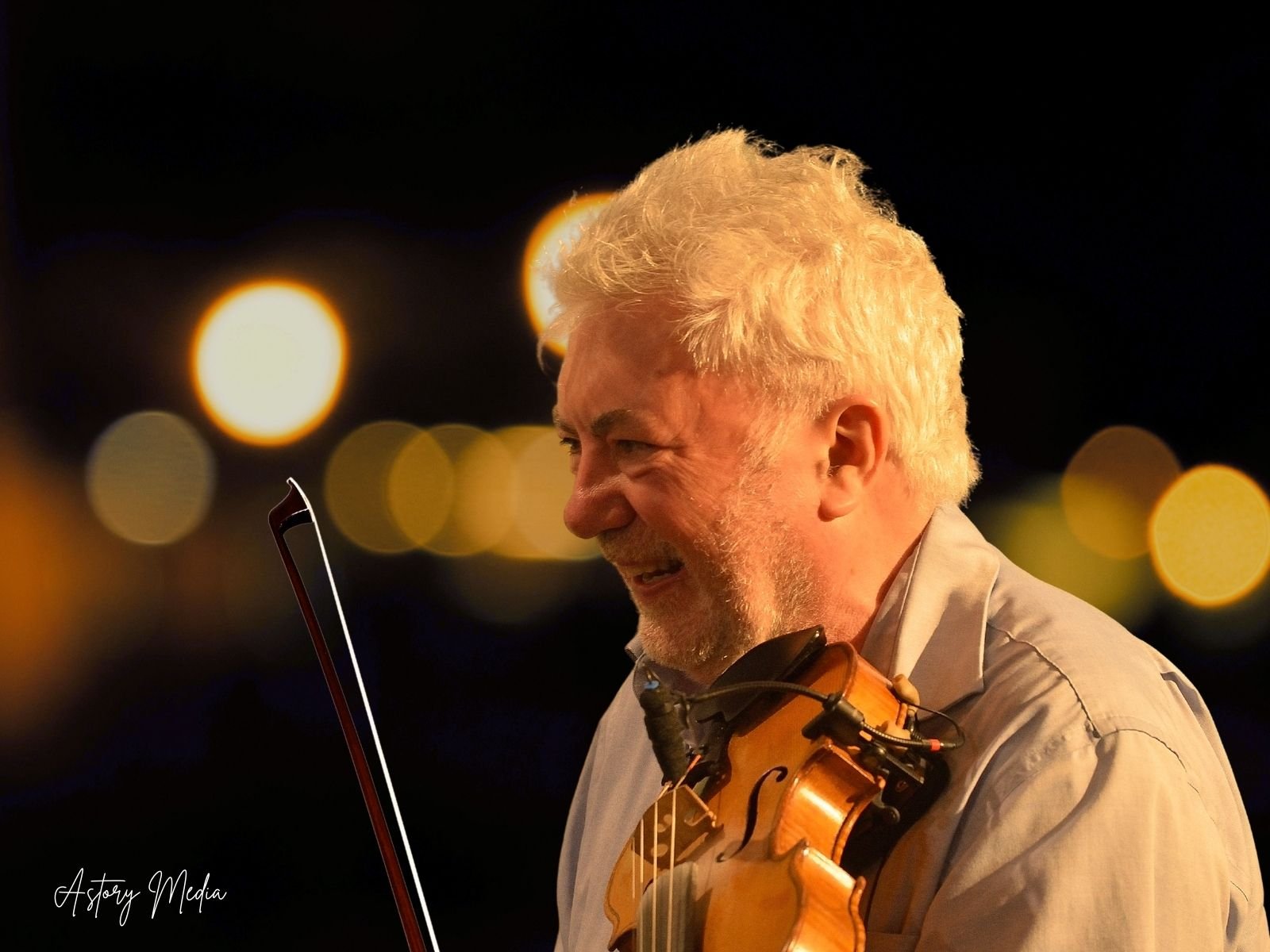 [Photo: Gerry O'Connor performing at the launch]