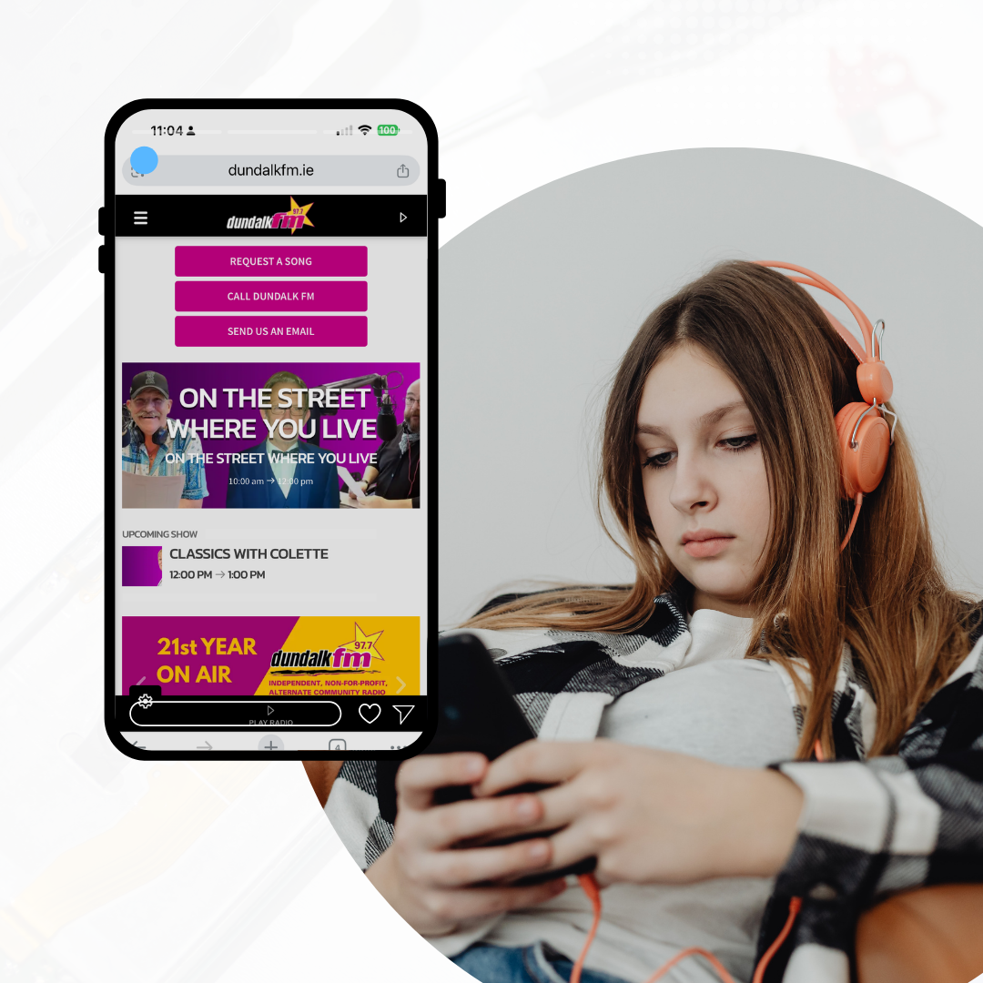 girl with a phone listening to dundalk fm and browsing website
